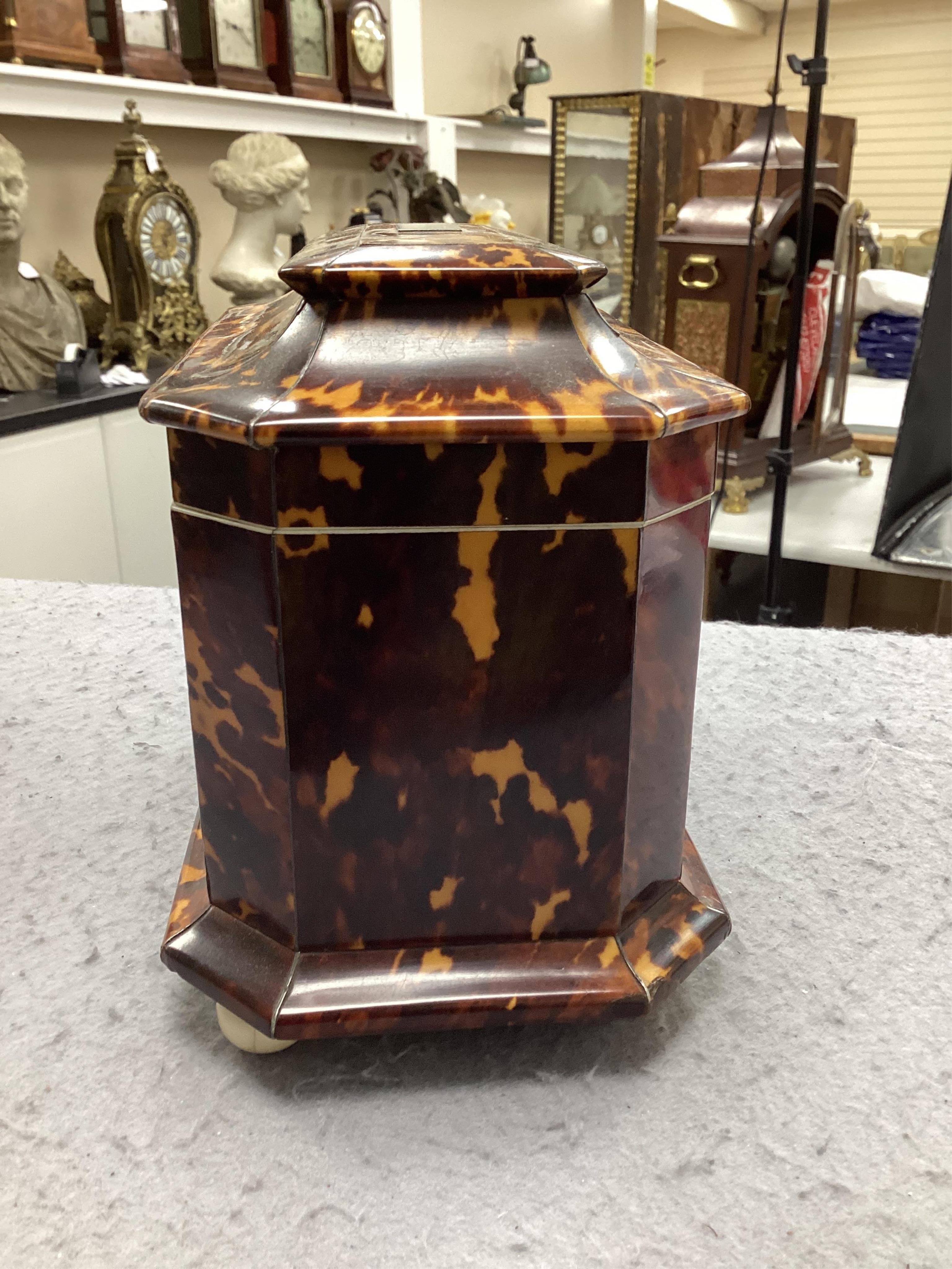 A Regency blond tortoiseshell and mother of pearl tea caddy